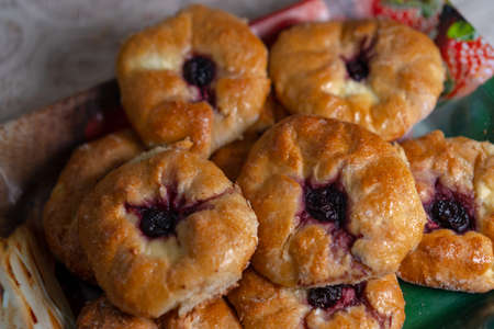 Sweet buns with cottage cheese and cherryの写真素材