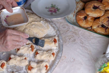 Lubricating the dough for buns before bakingの写真素材