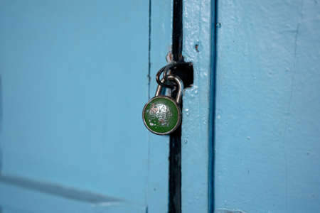 Closed lock on wooden wings