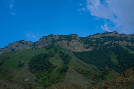 Mountains with vegetation against the sky