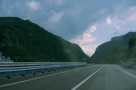 Auto highway with cars in the mountains