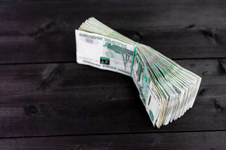 Pack of russian money on wooden background