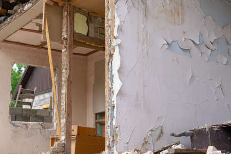 Ruined house in the background of the streetの写真素材