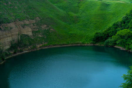 Mountain clear lake surrounded by plants