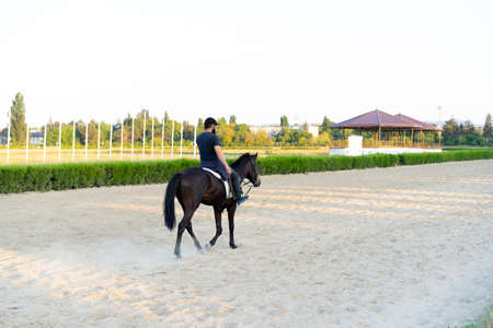 Man riding a horse at the racetrackの写真素材