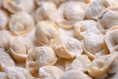 Dumplings made of dough, covered in flourの写真素材