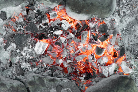 Hot coals from a burning fireの写真素材