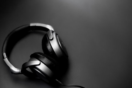 Headphones lie on a black backgroundの写真素材