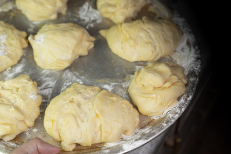Dough pieces on a tray For further bakingの写真素材
