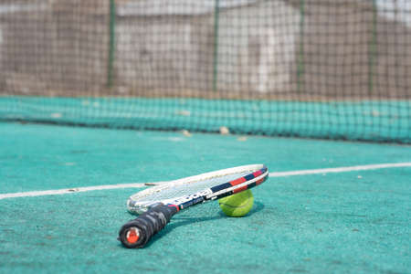 Tennis rocket and ball on the tennis courtの写真素材