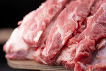 Fresh piece of raw meat on a cutting boardの写真素材