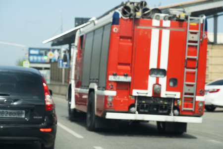 Fire truck driving on the roadの写真素材