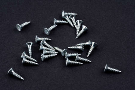 New screws on a black backgroundの写真素材