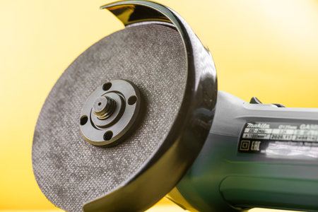 Grinder with cutting disc on backgroundの写真素材