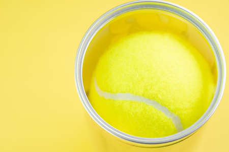 Tennis balls on yellow backgroundの写真素材