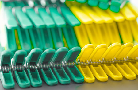 Clothespins of different colors fixed in a row