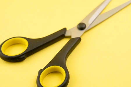 Household scissors on a yellow backgroundの写真素材