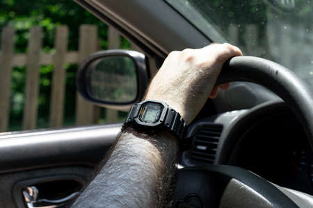 Rotating the steering wheel in a carの写真素材