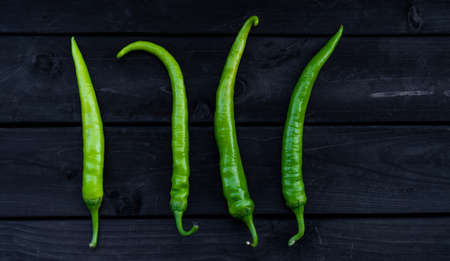 Ripe peppers on wooden backgroundの写真素材
