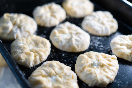 Cooking buns on a baking sheetの写真素材