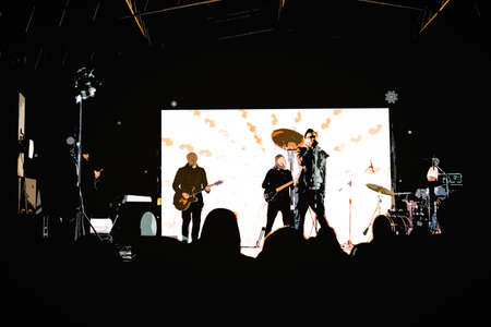Concert. Musicians playing musical instruments and a singing vocalist.の写真素材