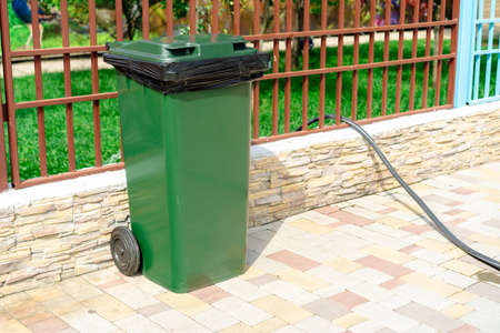 Trash can mounted on the groundの写真素材