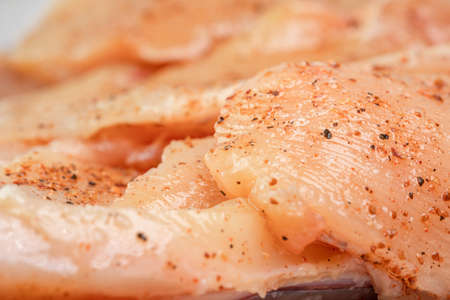Chicken pieces of meat with spicesの写真素材