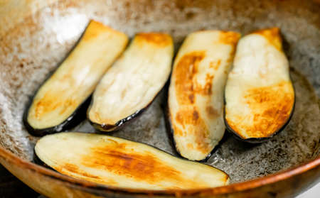 Eggplants are fried in a panの写真素材