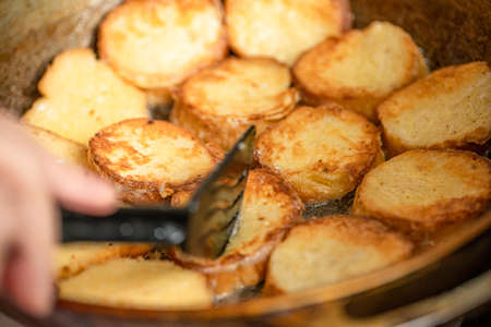 Toasting bread with an eggの写真素材