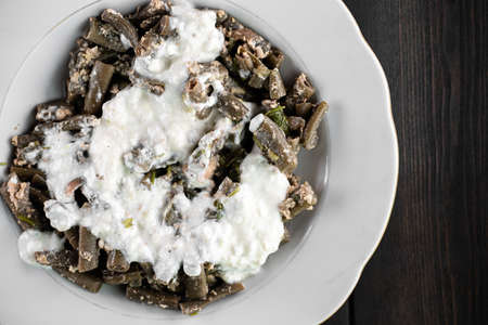 Cooked beans seasoned with sour cream and garlicの写真素材