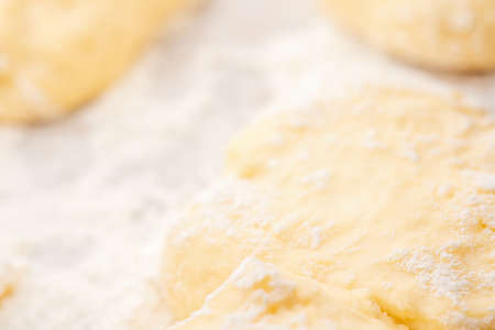 Dough and flour in the rays of lightの写真素材