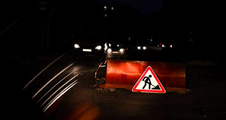 Road sign - watch out, repair work aheadの写真素材