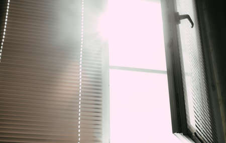 Light shines through the open windowの写真素材