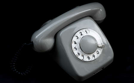 Rotary old telephone on black backgroundの写真素材
