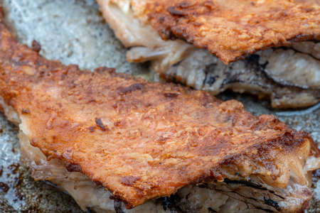 Pieces of fish fried in a panの写真素材