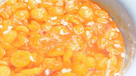 Apricot jam with apricot pitsの写真素材