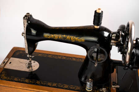Old sewing machine on a white backgroundの写真素材