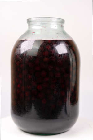 Jar with cherry jam isolated on white backgroundの写真素材