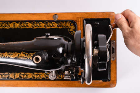Using an old sewing machineの写真素材