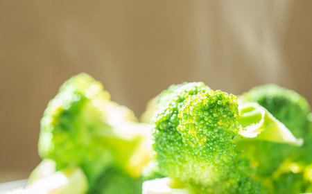 Cooked hot broccoli. Steam from broccoliの写真素材
