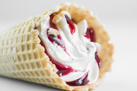 Ice cream in a cone on a white backgroundの写真素材