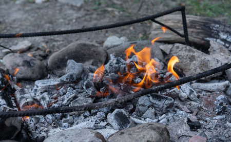 Coals after burning a fire for further cooking on coalsの写真素材