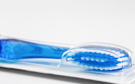 Toothbrush in package on white backgroundの写真素材