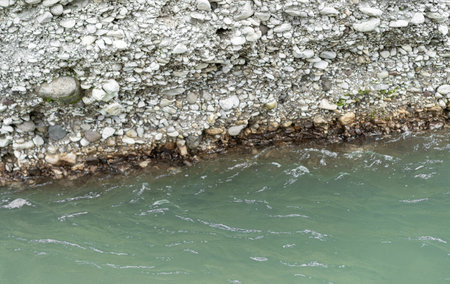 Stone stratification of the earth near the river bankの写真素材