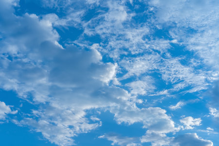 Blue sky and different cloudsの写真素材