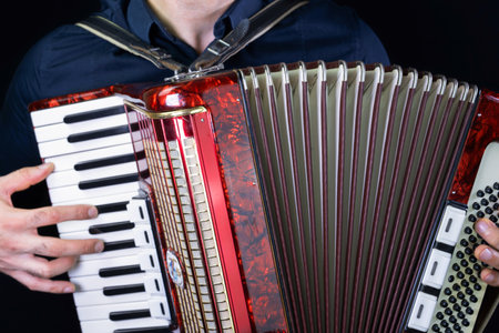 Man playing accordion with fingersの写真素材
