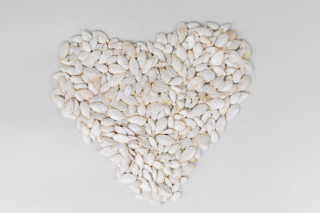 Seeds from a pumpkin forming a heartの写真素材