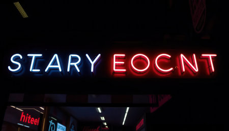 Captivating neon sign showcasing colorful illuminated letters in a dark urban environment, perfect for capturing the vibrant essence of nightlife and modern design.の素材