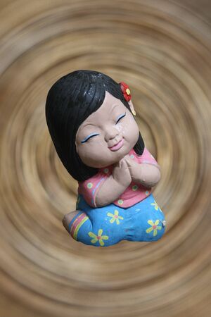 the baked clay doll made in thailandの写真素材