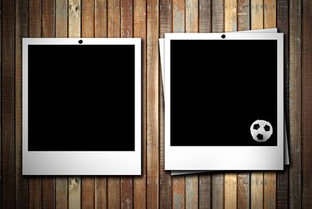 Two photoframe with soccer ball on  empty woodの写真素材